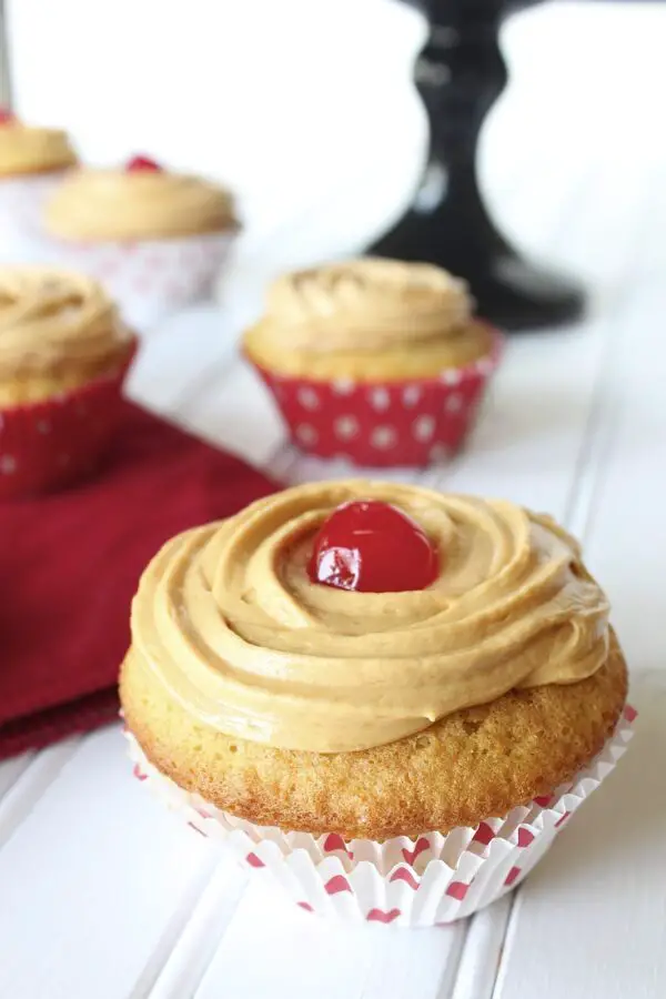 preparetion-of-tres-leches-cupcakes-with-a-dulce-de-leche-frosting