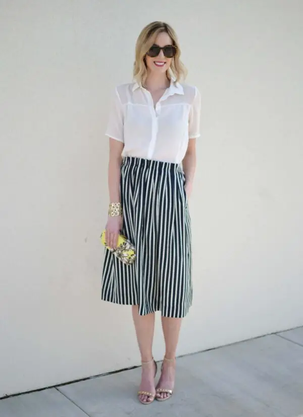 1-striped-skirt-with-white-blouse-and-graphic-print-clutch