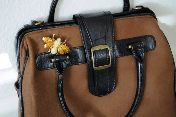 bag-with-bee-brooch