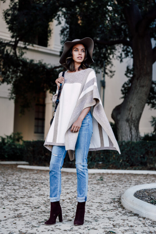 jeans with poncho and floppy hat